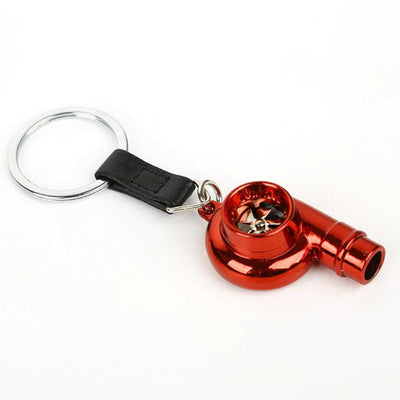 Red turbo keychain with realistic rotating turbine, perfect for car enthusiasts, made of durable metal.